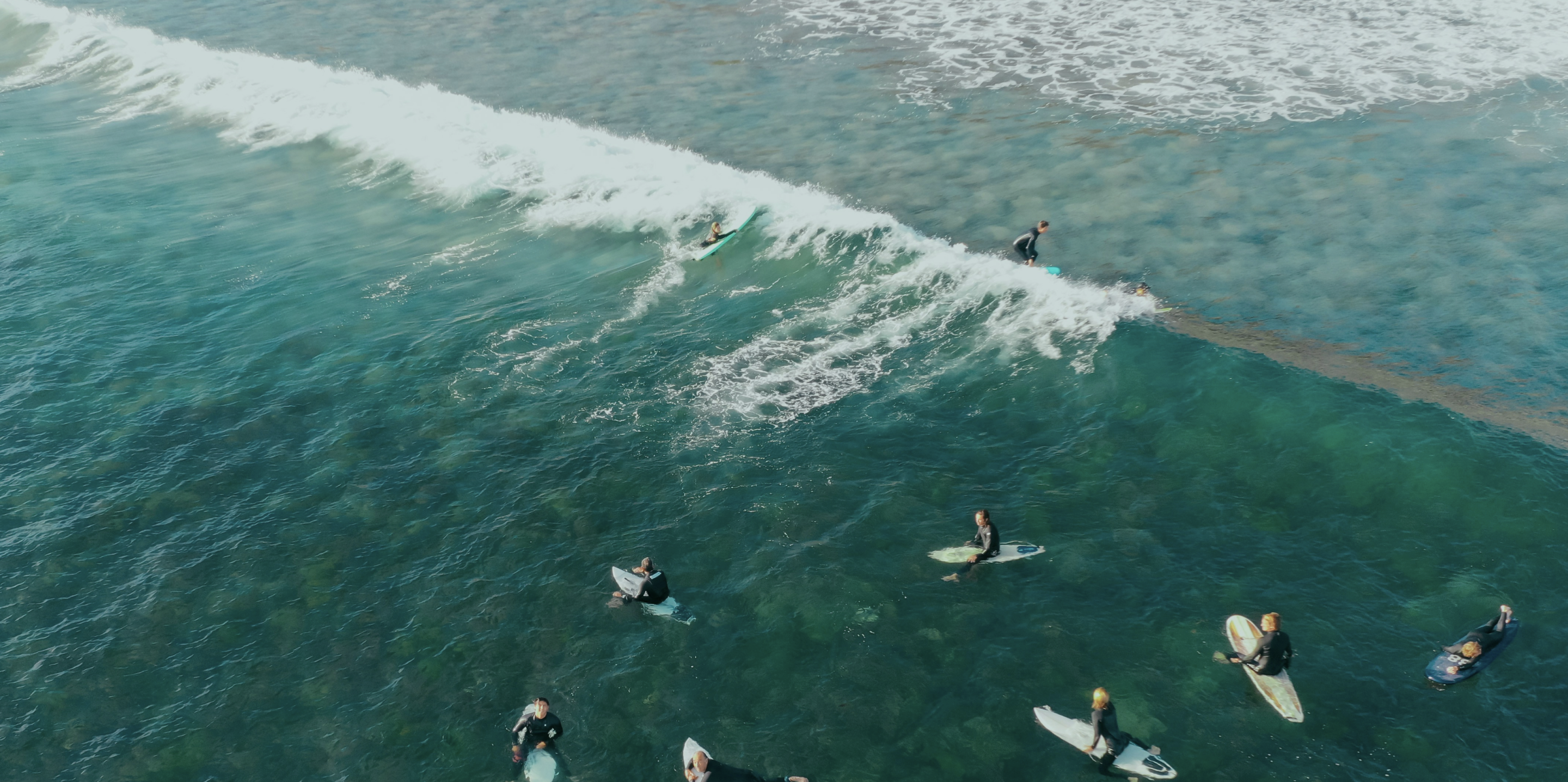 Surfers in calm water